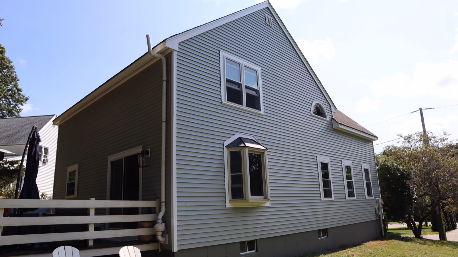 New sage siding with white trim